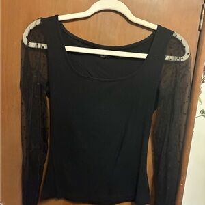 Black shirt with sheer polkadot long sleeves and solid black cuffs